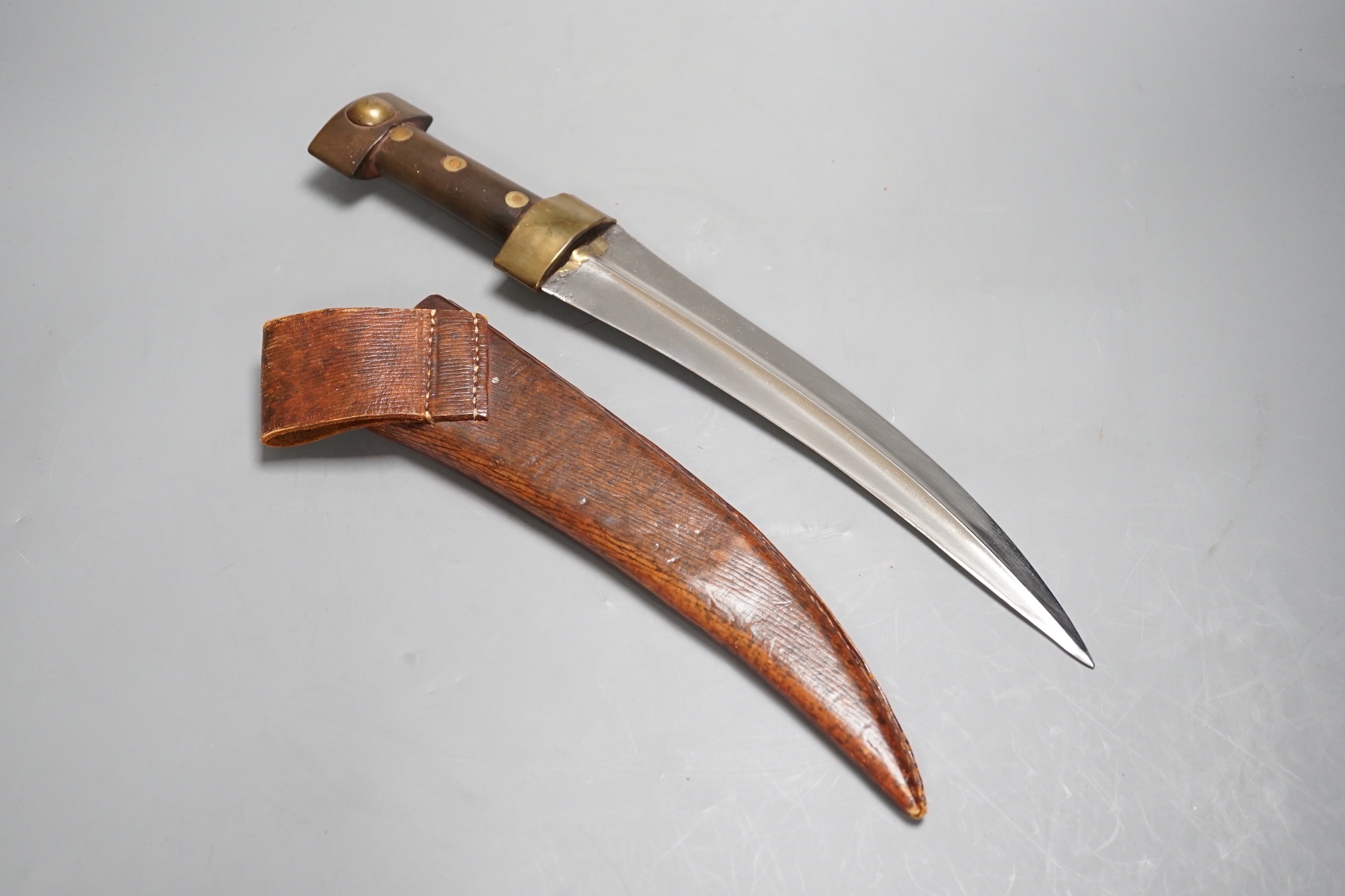 A Middle Eastern horn handle Jambiya dagger and sheath 39cm